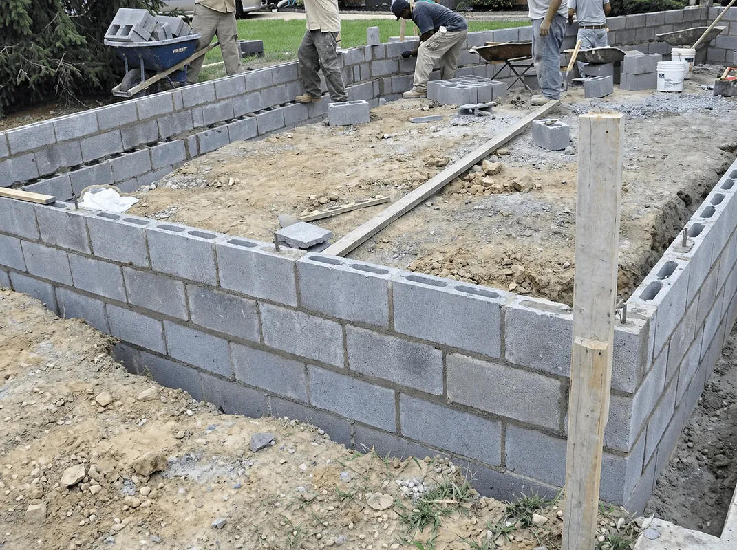 Professionals building a foundation with blocks in Boston, MA