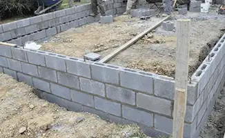 Professionals building a foundation with blocks in Boston, MA