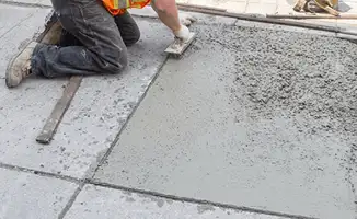 Professional repairing a concrete floor in Boston, MA